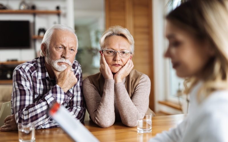 Couple listening intently to doctor